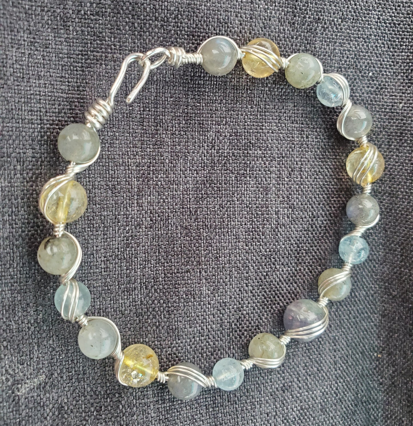 Sterling silver wire wrapped bracelet with tanzanite, aquamarine, citrine, and labradorite