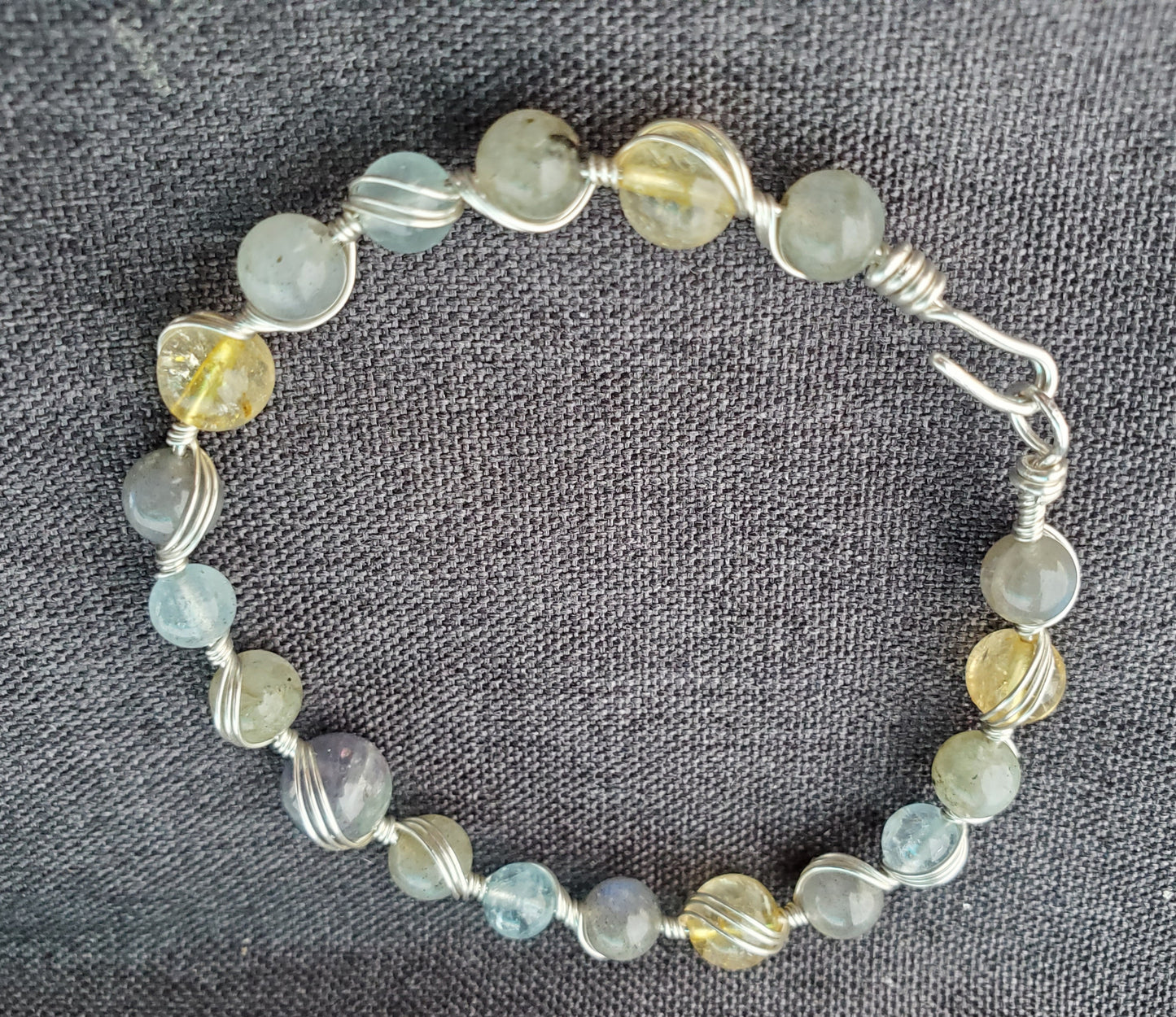 Sterling silver wire wrapped bracelet with tanzanite, aquamarine, citrine, and labradorite